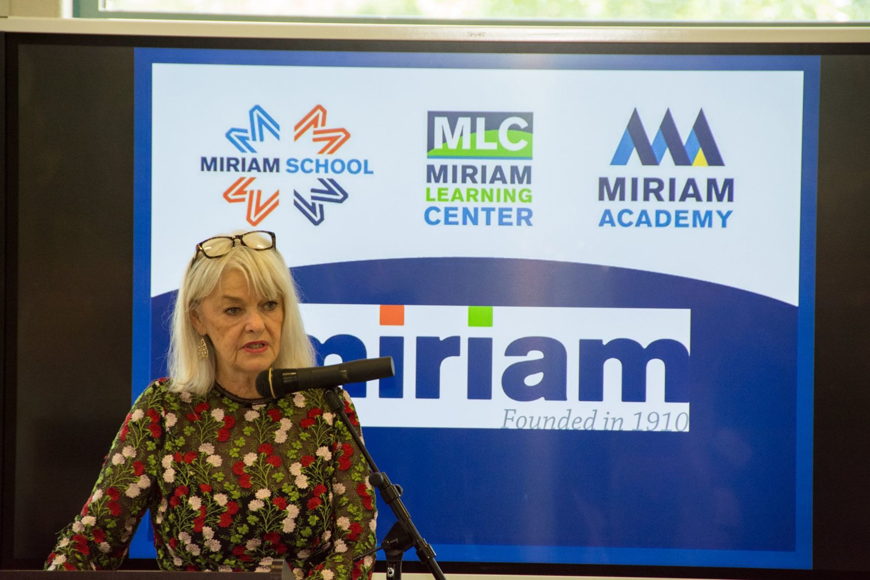 Linda Estell speaks at the Friends of Miriam Luncheon to introduce the award winner Amye Carrigan